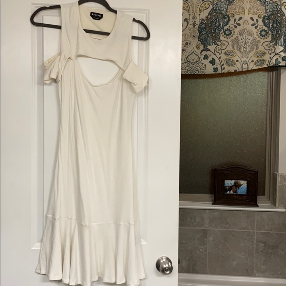 Cute fitted ribbed ivory dress with flutter bottom